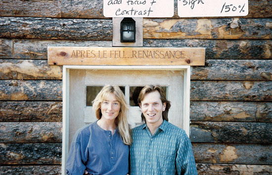 A headstone over the door of a cabin Susan and Tom built after the fire, below, means “After the fire, rebirth.”